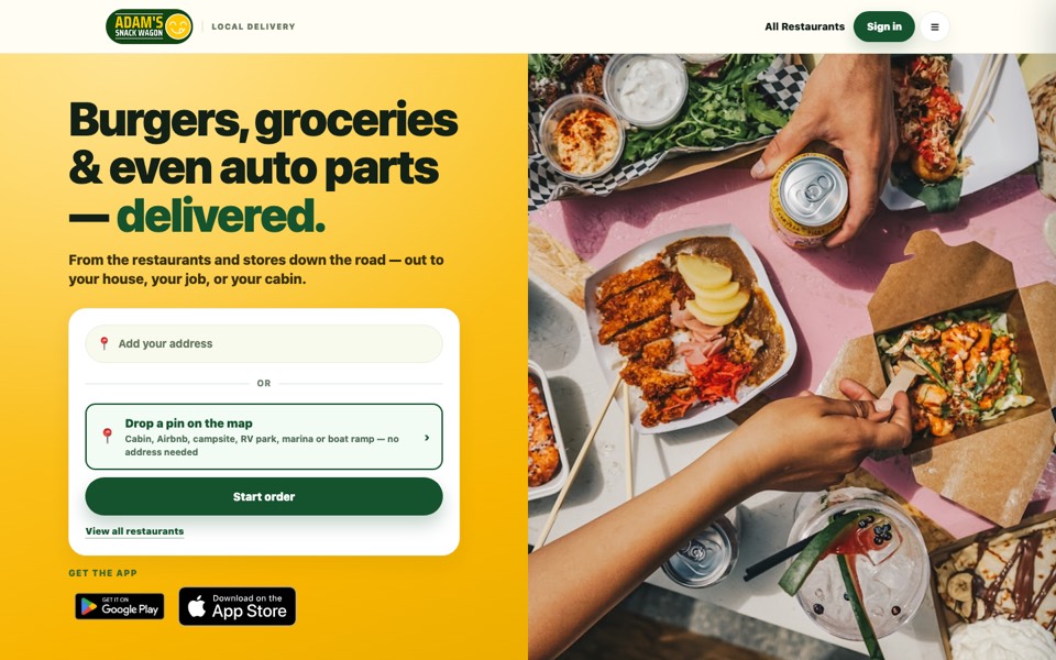 Adam's Snack Wagon website on a laptop